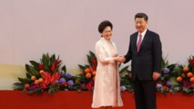 Carrie Lam-a la izquierda-y Xi Jinping Carrie Lam-a la izquierda-y Xi Jinping