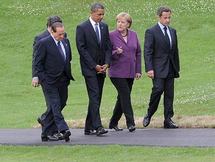 De izquierda a derecha, Silvio Berlusconi, Barak Obama, Angela Merkel y Nicolas Sarkozy