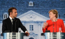 Macron-a la izquierda-y Merkel Macron-a la izquierda-y Merkel