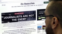 El titular "los periodistas no son el enemigo" en el Boston Globe