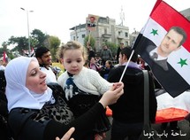 Una mujer participa en una manifestación a favor del gobierno en Damasco, Siria. Una mujer participa en una manifestación a favor del gobierno en Damasco, Siria.
