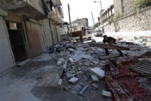 Una calle con casas medio destruidas en Alepo, Siria.