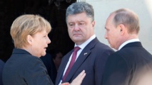 De izquierda a derecha, Merkel, Poroshenko y Putin