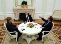 De izquierda a derecha, Merkel, Putin y Hollande De izquierda a derecha, Merkel, Putin y Hollande