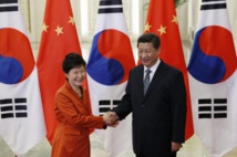 Los presidentes de Corea-Park, a la izquierda-y de China, Xi