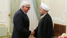 El ministro de Exteriores alemán, Steinmeier-a la izquierda-y el presidente iraní, Rohani.