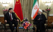 Xi Jinping-a la izquierda-y Hasan Rohani