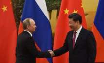 Vladimir Putin-a la izquierda-y Xi Jinping