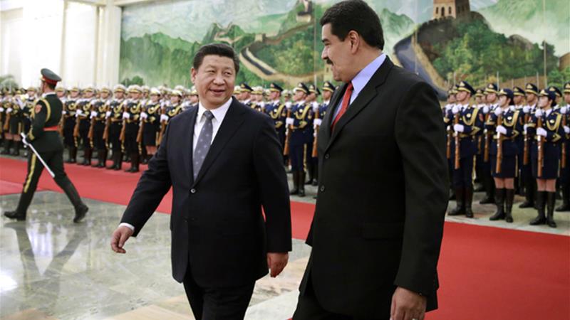 El presidente chino Xi-izquierda-y el venezolano Maduro