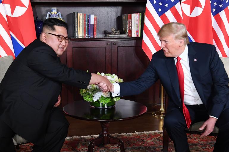 Kim Jong Un-a la izquierda-y Donald Trump.
