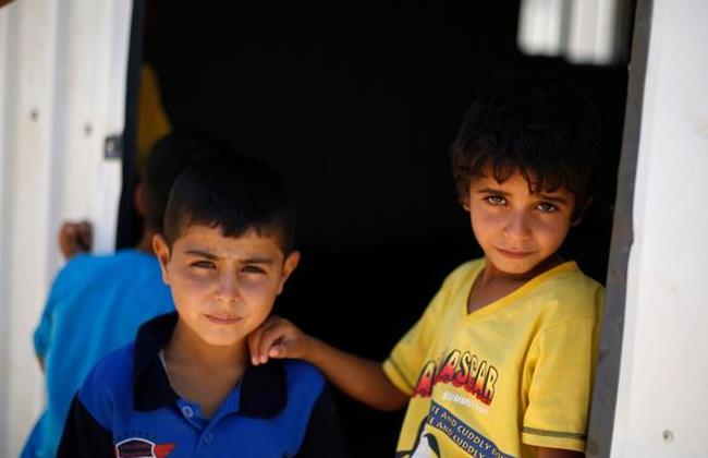 Niños sirios en un campo de refugiados en Jordania Niños sirios en un campo de refugiados en Jordania